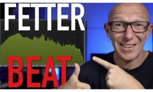 Mann zeigt auf Spektrumanalysator mit "FETTER BEAT" und grünen Kurven, die auf kraftvolle drum loops hindeuten.