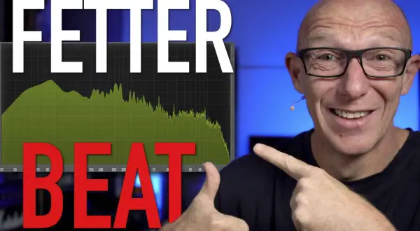 Mann zeigt auf Spektrumanalysator mit "FETTER BEAT" und grünen Kurven, die auf kraftvolle drum loops hindeuten.