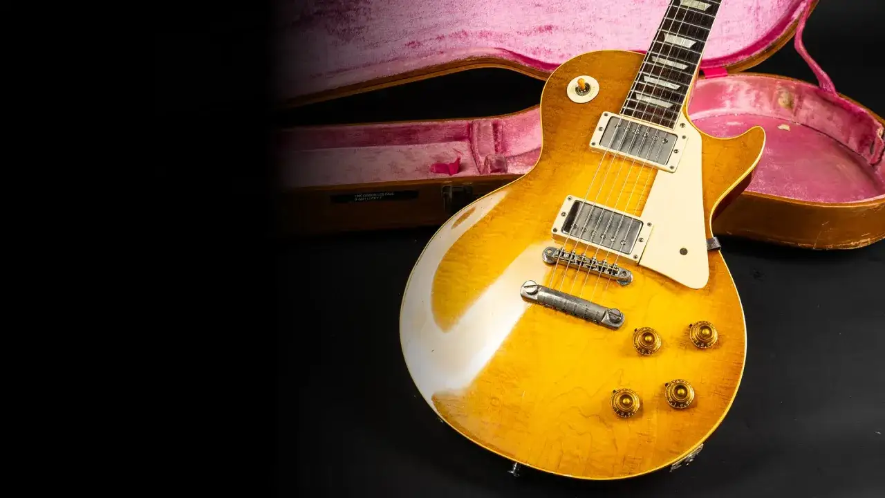Eine goldene E-Gitarre mit pinkem Koffer. So k&ouml;nnte die erste Gitarre ausgesehen haben, ein Meisterwerk der Musikgeschichte.